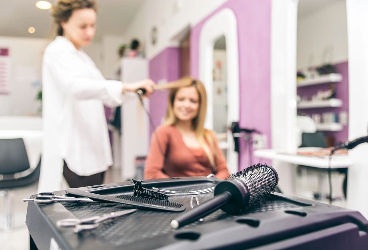 A woman getting her hair done in a salon.