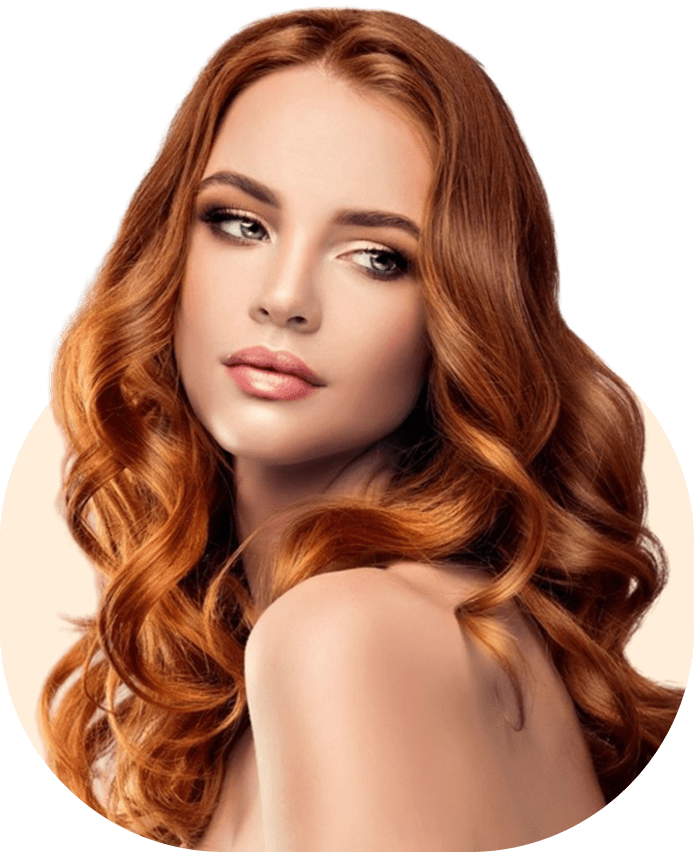 A woman with long red hair and green eyes.