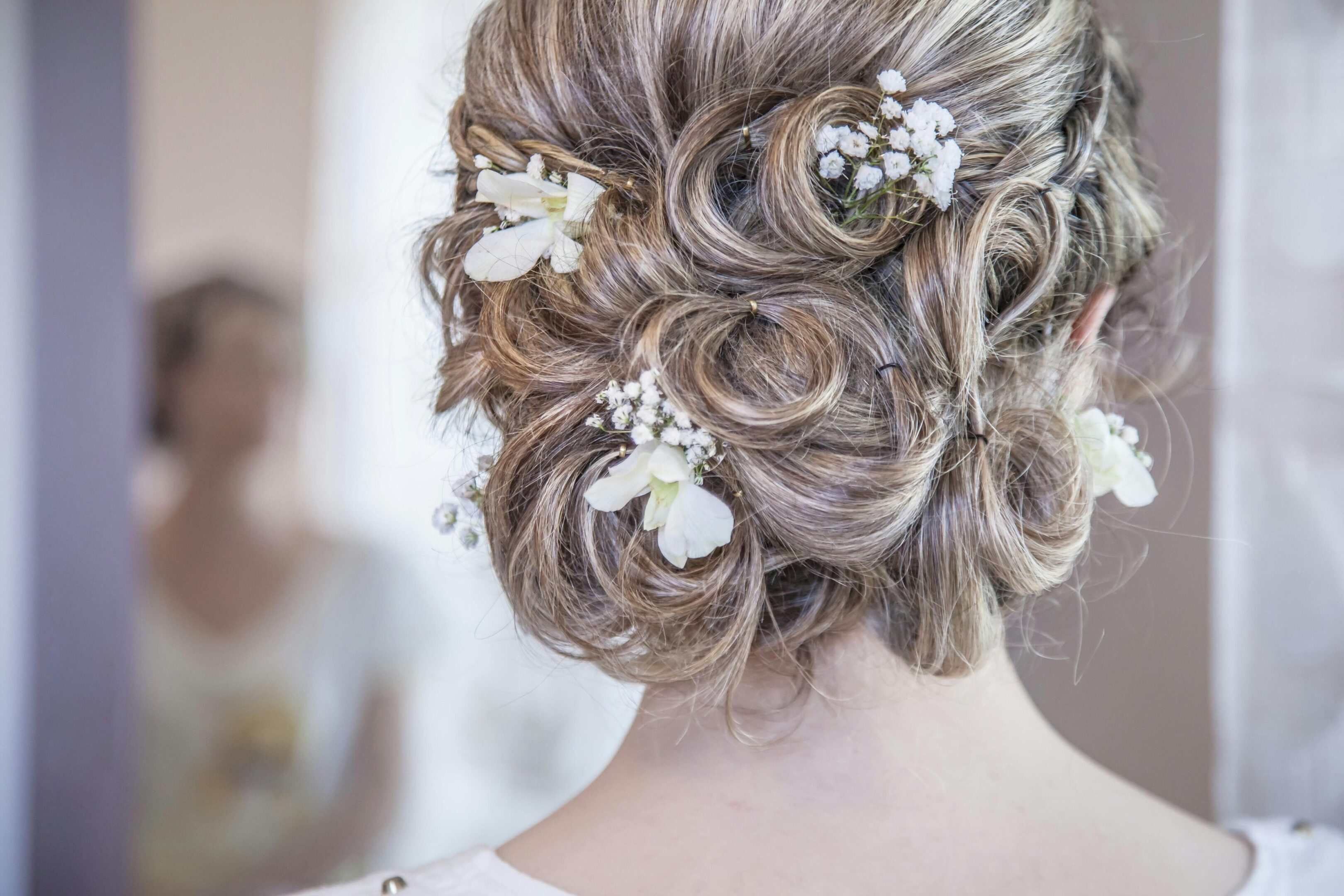 A woman with long hair and flowers in her hair.